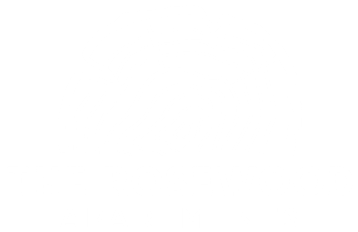 A black and white image of a tree stump with the words "The Rosewood Apartments" written below it.